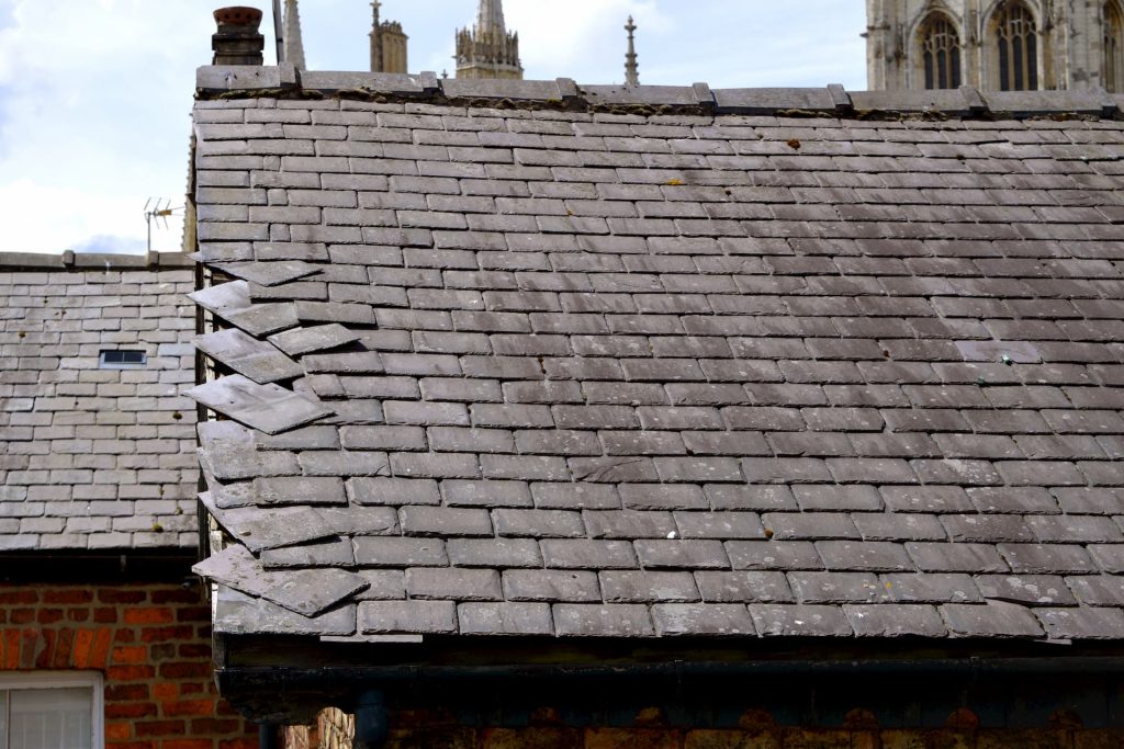 slipped tiles on damaged roof on house in hereford